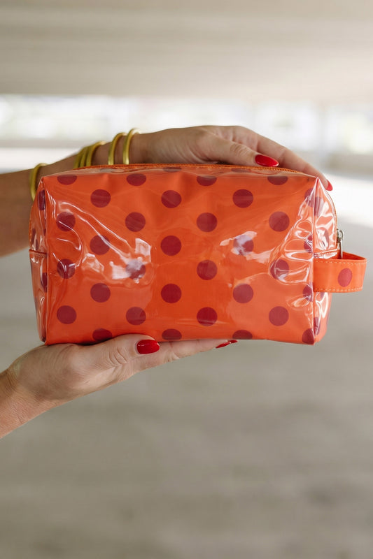 Neceser de PVC naranja resistente con estampado de lunares