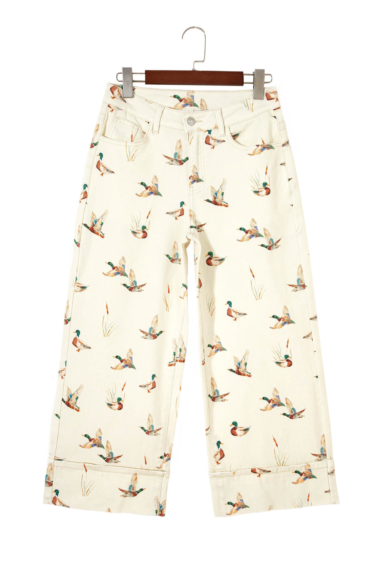 Vaqueros beige elegantes con estampado de patos y bajo con puños