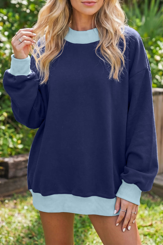 Sudadera de cuello redondo y manga larga en azul sucio con diseño de bloques de color y ribetes