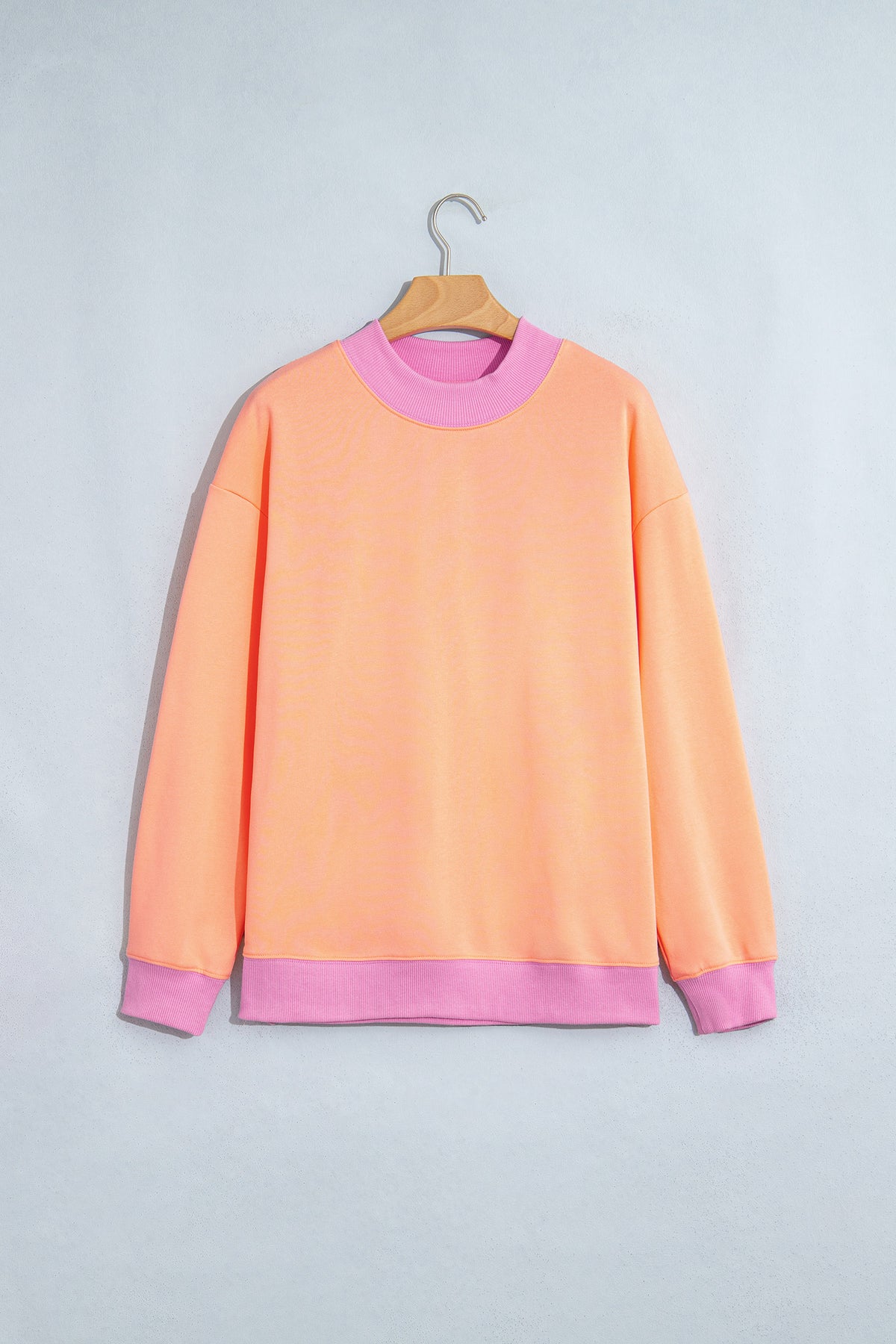 Sudadera de cuello redondo y manga larga en azul sucio con diseño de bloques de color y ribetes