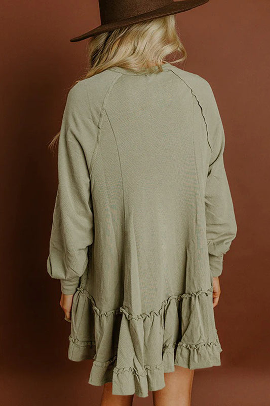 Minivestido de manga larga con volantes y jacquard verde laurel