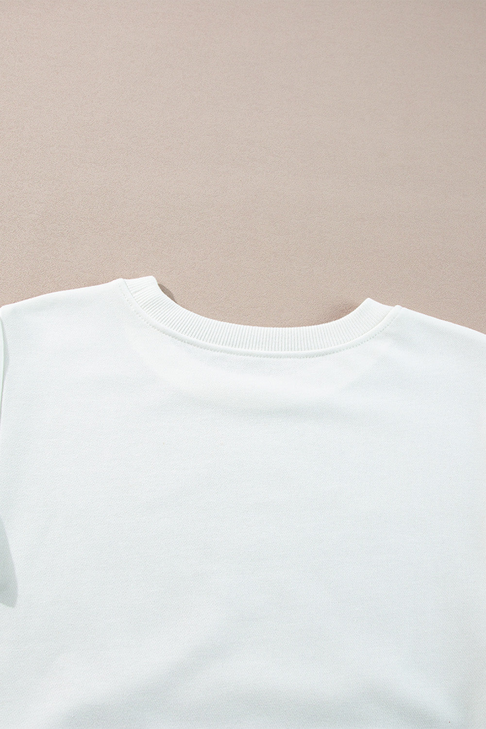 Top de manga larga estilo *color block* en *French Terry* blanco