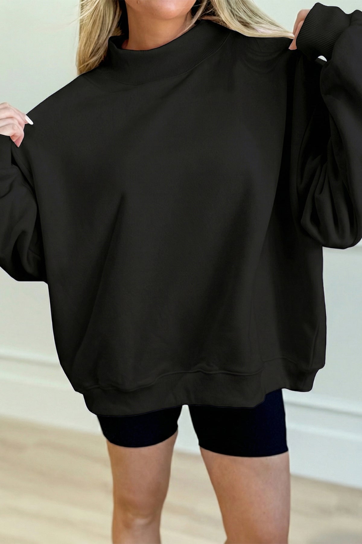 Sudadera negra lisa de corte oversize y cuello perkins