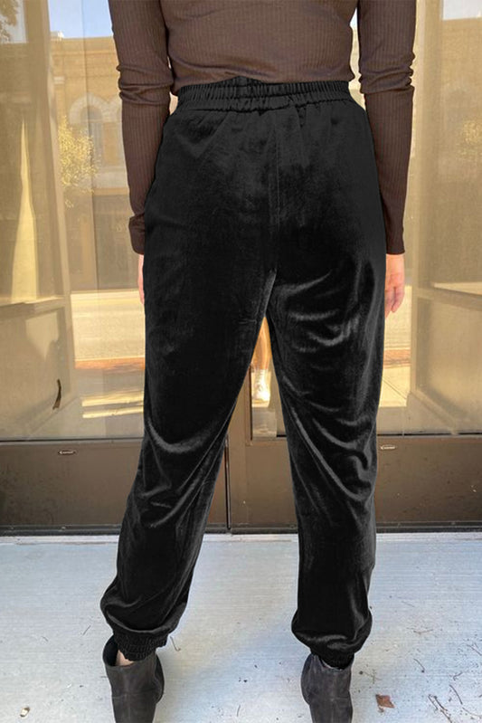 Pantalones tipo jogger de terciopelo negro liso