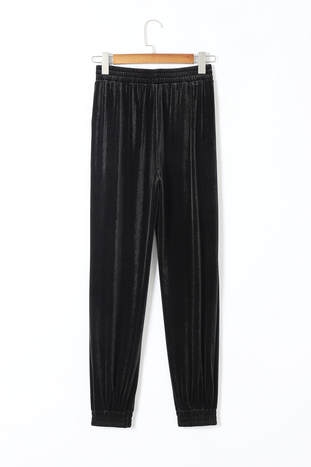 Pantalones tipo jogger de terciopelo negro liso