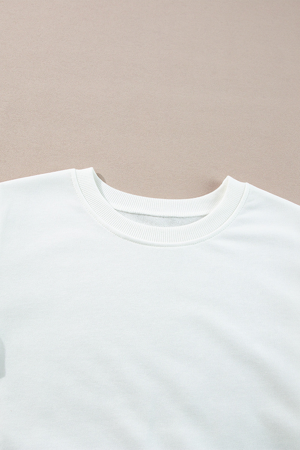 Top de manga larga estilo *color block* en *French Terry* blanco