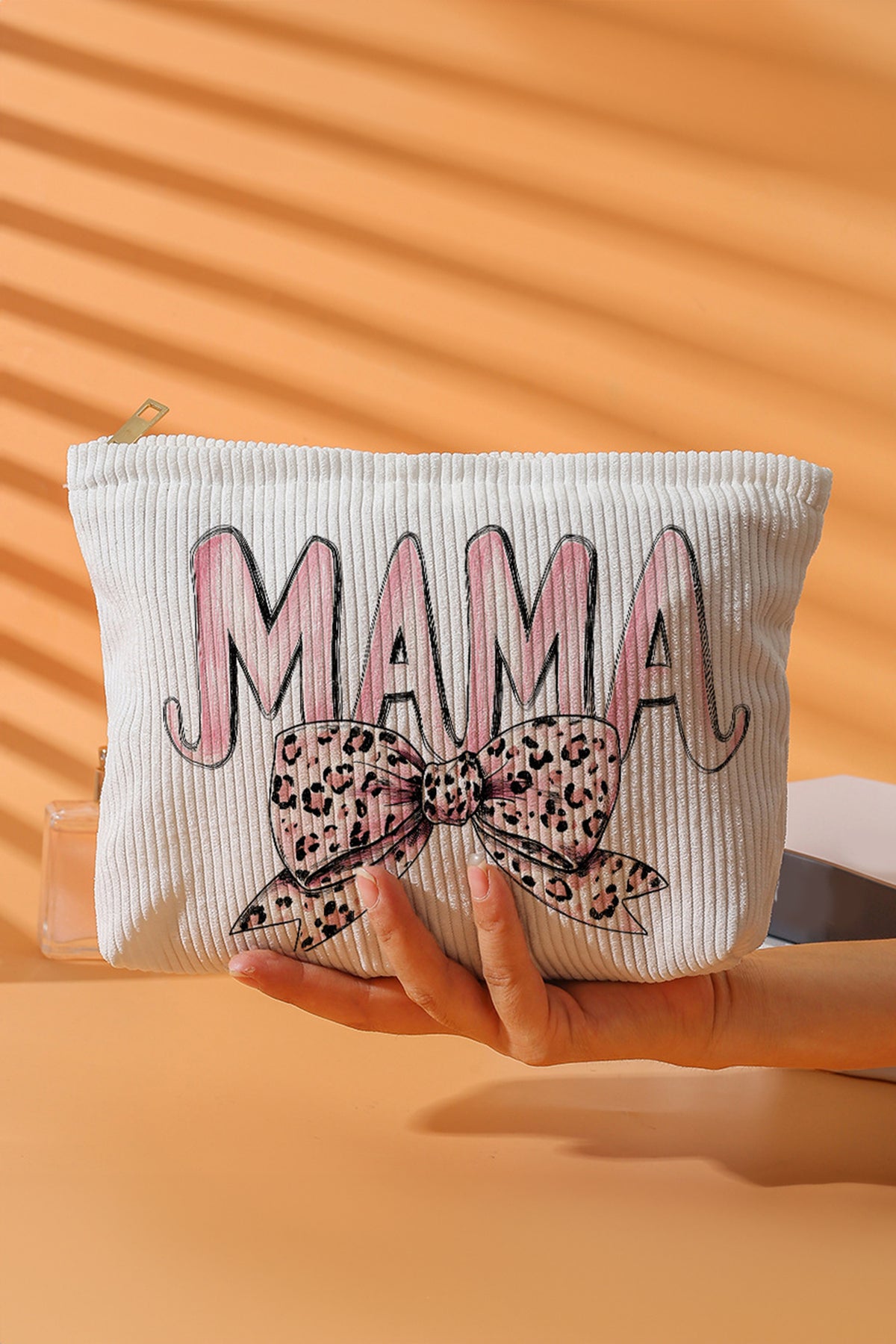 Neceser blanco con estampado de leopardo y lazo