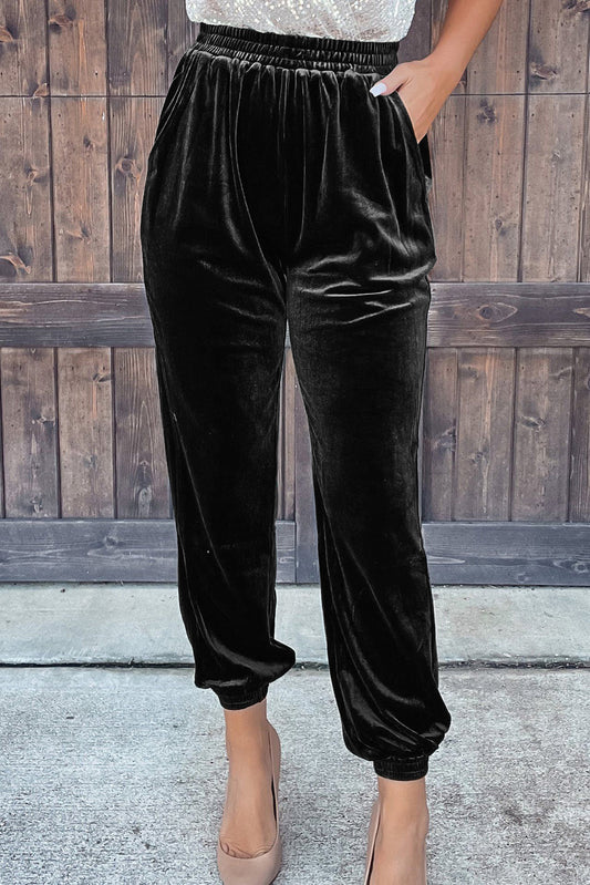 Pantalones tipo jogger de terciopelo negro liso