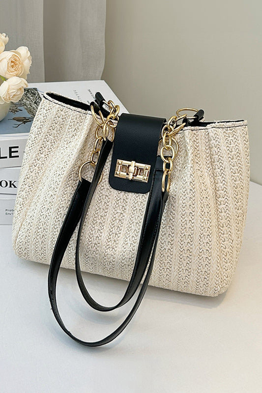 Bolso tote negro de piel sintética con textura tejida y asa de cadena