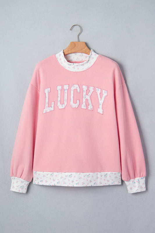 Sudadera rosa de manga larga con cuello alto y bordado de parches florales